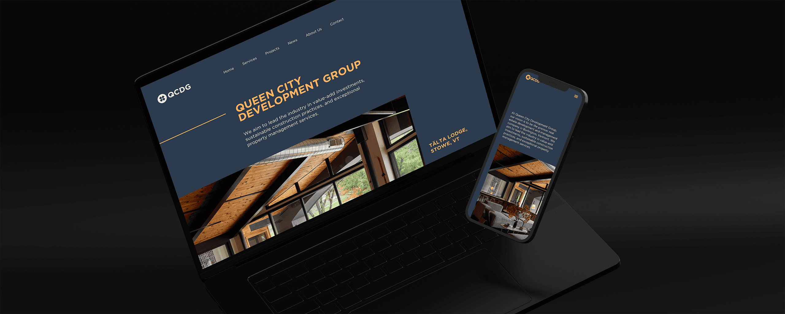 Laptop and smartphone displaying a website mockup for Queen City Development Group with a focus on sustainable construction.